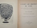an open book with a picture of a vase on it