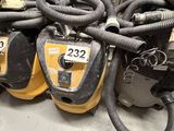 several vacuums are stacked on top of each other in a room