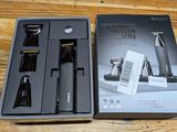 a box with a shaver and a razor in it on a wooden table