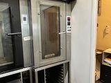 two ovens that are sitting in a room