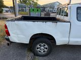 a white truck that is parked on the side of the road
