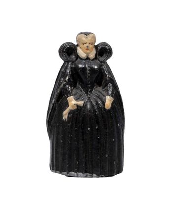a close up of a figurine of a woman in a black dress