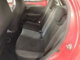 a red car with black seats in the back of it