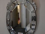 a mirror hanging on the wall in a room