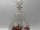 a glass vase with flowers inside of it on a table