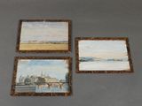 three paintings on a table with a picture of a bridge in the background