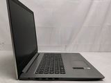 an open laptop computer sitting on top of a white surface