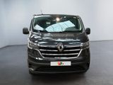 the front view of a black car in a showroom