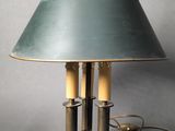 a table lamp that is on a plate with a lamp on it
