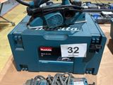a blue box with tools on a table in a workshop