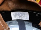 a close up of a brown hat with a label on it