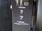 a snowboard that is attached to the side of a trash can
