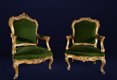 pair of green velvet and gilded chairs with gold trim