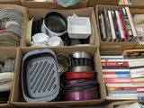 a box full of assorted kitchenware and cookware