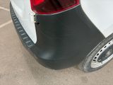 a close up of the rear end of a white car