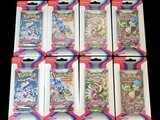 Un colis contient six paquets de cartes à collectionner Pokémon
