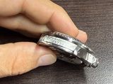 a person that is holding a watch in their hand