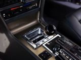 a close up of a car ' s gear box in the driver ' s seat