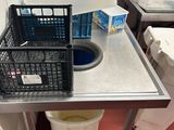 a small table with a basket on top of it