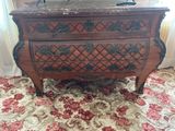 a wooden chest with a mirror on top of it