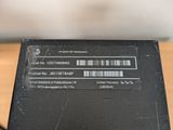 a black box with a barcode on it sitting on a table