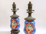 two vases that are sitting on a table
