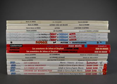 many books stacked on top of each other on a table