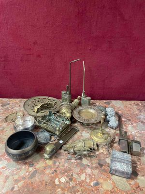 a table with a bunch of silver objects on it