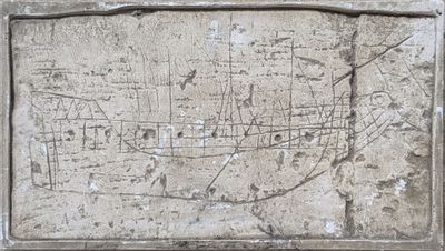 a stone plaque with a map on it on the wall