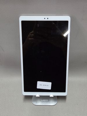 une image représentant une tablette blanche posée sur une table blanche