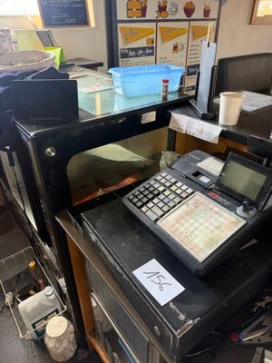 a cash register sitting on top of a counter