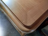 a close up of a table with a wooden top