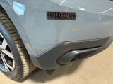 the rear end of a car with a sticker on it ' s bumper