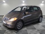 a picture of a brown mercedes b - class parked in a garage