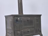 an old stove with a chimney on top of it