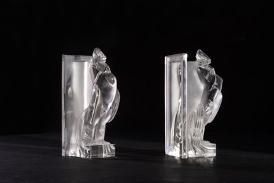 pair of art deco glass bookends of a woman and a man