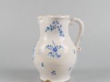 an image of a blue and white vase on a gray surface