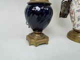 two vases sitting next to each other on a table