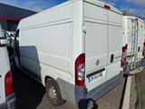 a white van that is parked in a parking lot