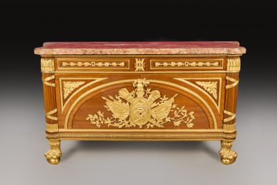 an antique wooden chest with a marble top and gold decoration