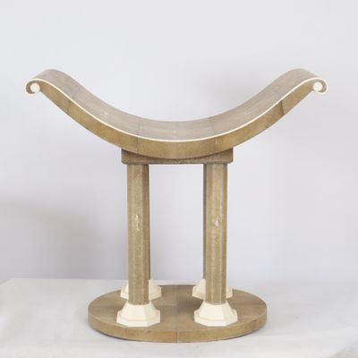 a close up of a wooden bench on a white surface