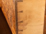 a wooden drawer with two drawers on top of it