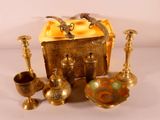 a gold box with a bunch of different items on it