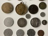 a lot of coins that are on the table