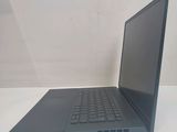 the back of a laptop computer sitting on top of a white table