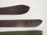 three different types of knives on a white surface
