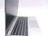a close up of a laptop computer on a white surface