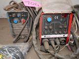 a couple of welding equipment sitting next to each other