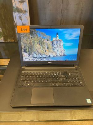 a laptop that is sitting on a table with a price tag