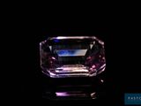 a purple diamond on a black background